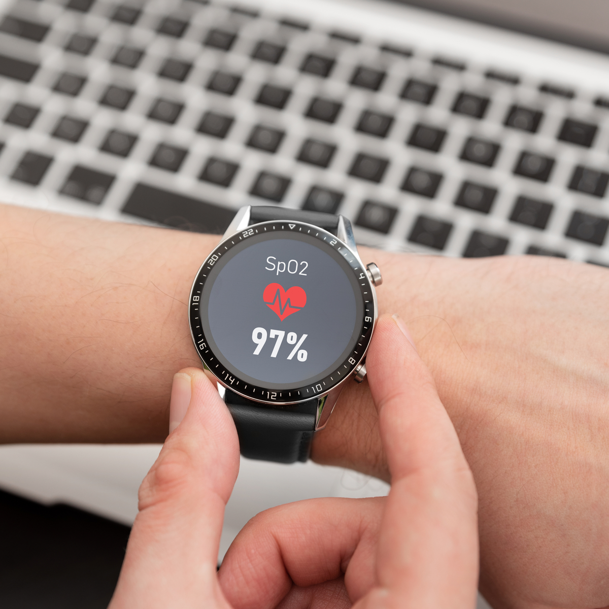 Optical sensor window of a health smartwatch showing SpO2 reading